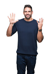 Young handsome man wearing sweater over isolated background showing and pointing up with fingers number nine while smiling confident and happy.