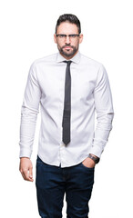Young handsome business man wearing glasses over isolated background skeptic and nervous, frowning upset because of problem. Negative person.