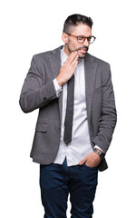 Young handsome business man over isolated background touching mouth with hand with painful expression because of toothache or dental illness on teeth. Dentist concept.