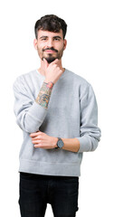 Young handsome man wearing sweatshirt over isolated background looking confident at the camera with smile with crossed arms and hand raised on chin. Thinking positive.