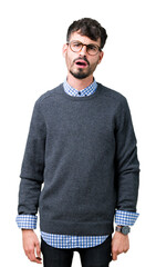 Young handsome smart man wearing glasses over isolated background In shock face, looking skeptical...