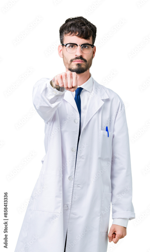 Sticker Young professional scientist man wearing white coat over isolated background Punching fist to fight, aggressive and angry attack, threat and violence