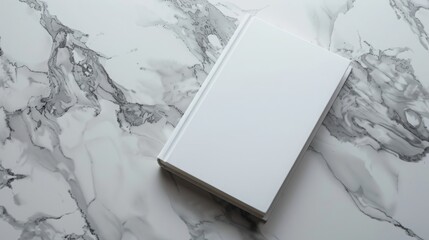 Minimalistic white book cover mockup on marble background