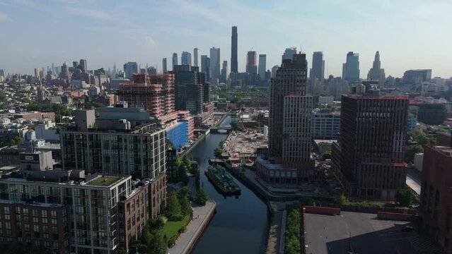 flying over Gowanus Canal towards downtown Brooklyn skyline