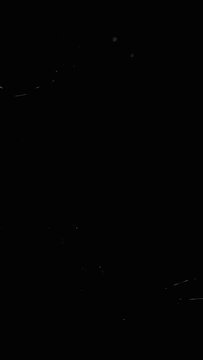 Vertical video film burn overlay transitions. Old film rolling effect. Dust and particles overlay. High quality 4k footage