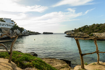 Obraz premium Tranquil Cala Alfacar Cove at Sunset, Menorca