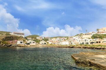 Obraz premium Picturesque Coastal Village of Cala des Murtar, Menorca
