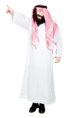Arabian business man with long hair wearing traditional keffiyeh scarf Pointing with finger surprised ahead, open mouth amazed expression, something in front