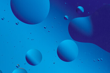 Abstract gradient background with smooth lines and circles of blue color.