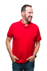Fototapeta premium Middle age hoary senior man over isolated background looking away to side with smile on face, natural expression. Laughing confident.