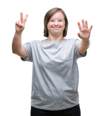 Young adult woman with down syndrome over isolated background showing and pointing up with fingers number seven while smiling confident and happy.