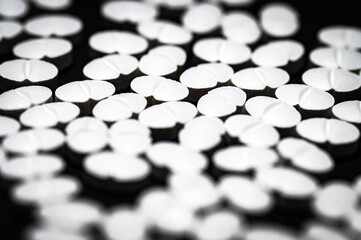 Narcotic substances, antidepressant, dope powder, syringes with drugs dose, white pills on dark textured background. Concept of addiction and bad habits.