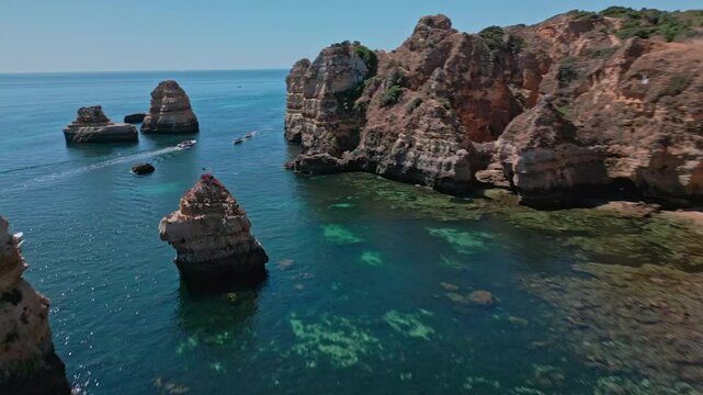 Drone view of the beautiful coast of Lagos, Portugal. Praia do Camilo 