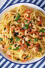 Homemade Garlic Shrimp Scampi with Parsley on a Plate, top view. Close-up.