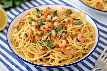 Homemade Garlic Shrimp Scampi with Parsley on a Plate, low angle view. Close-up.