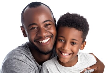 Happy African American father and son embrace on white background.