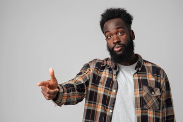 Fototapeta premium black man pointing at white background black man pointing at white background.