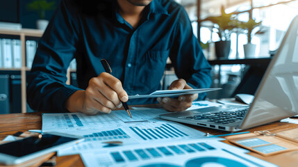 Professional auditor reviewing financial statements in organized office