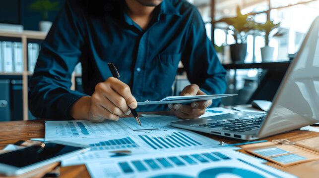 Professional auditor reviewing financial statements in organized office