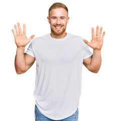 Young irish man wearing casual clothes showing and pointing up with fingers number ten while smiling confident and happy.