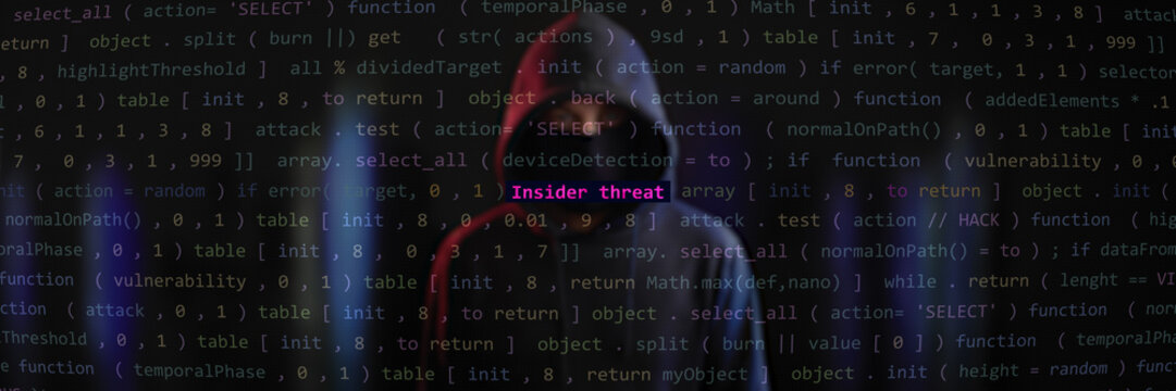 Insider threat cyber attack. Anonymous hacker hidden with hoodie in the blurred background. Vulnerability text in binary system ascii art style, code on editor screen. Text in English, English text