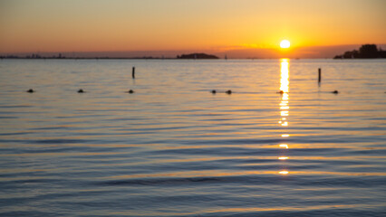 blurred peaceful sea sunset, smoothing water, vacation concept background