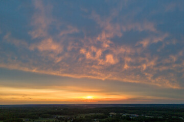 Fiery sunset, colorful clouds in the sky. Aerial of Cloud with sunset sky background