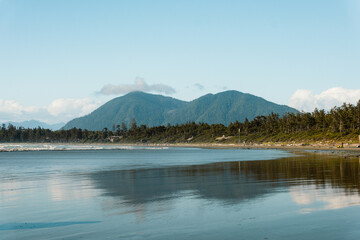 Mountain reflection off the beach at Cox Bay in Tofino, BC 