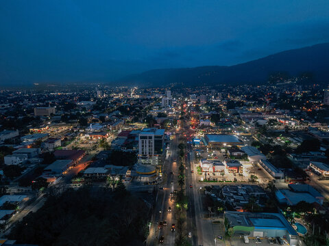 traffic in the city of san pedro sula at sunset 