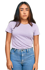 Obraz premium Young latin woman wearing casual clothes depressed and worry for distress, crying angry and afraid. sad expression.