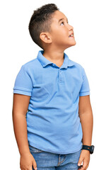 Little boy hispanic kid wearing casual clothes looking away to side with smile on face, natural expression. laughing confident. © Krakenimages.com