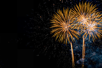 Gold fireworks on black background with copyspace
