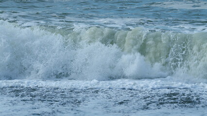 Stormy Seascape. Blue Water Of Ocean Crashing. Breaking Surf With Foam In Ocean. Slow motion.