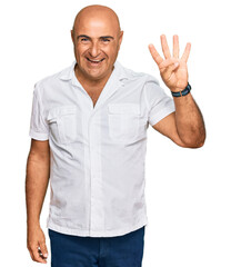 Mature middle east man with mustache wearing casual white shirt showing and pointing up with fingers number four while smiling confident and happy.