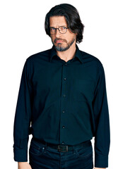 Middle age caucasian man wearing casual clothes and glasses skeptic and nervous, frowning upset because of problem. negative person.