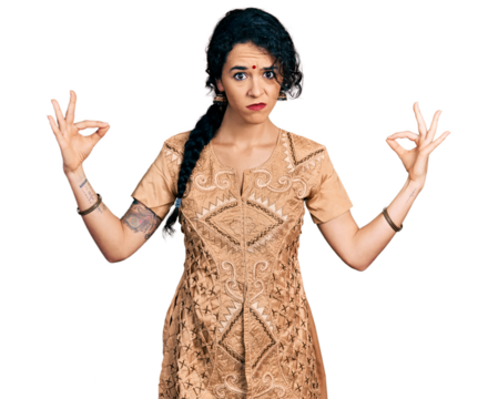 Young indian woman doing gyan mudra skeptic and nervous, frowning upset because of problem. negative person.