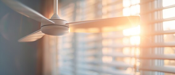 Ceiling fan spinning to cool a room, providing comfort in summer heat