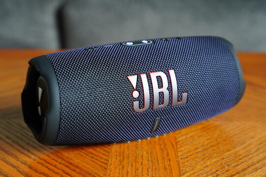 JBL Charge 5 Bluetooth speaker sits on the table. 