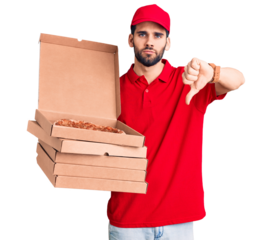 Young handsome man with beard wearing delivery uniform holding boxes with pizza with angry face, negative sign showing dislike with thumbs down, rejection concept