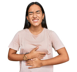 Young asian woman wearing casual clothes with hand on stomach because nausea, painful disease...