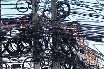 Telephone lines in the capital of Thailand. Unorganized, difficult, confusing