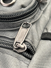 close up of a fabric bag and zipper. © mansum008
