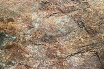 Mountain rock texture. Natural brown slate granite slab marble stone ceramic seamless tile rough surface background.