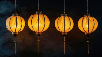 Four yellow silk lanterns hanging with dark background and copy space