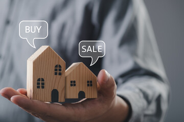 house or building or land value property tax, local development tax concept. Word tax, buy or sale home icon on hand, depicts ad valorem tax on value of a property.