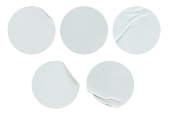 A set of blank white round adhesive paper sticker label isolated on white background.