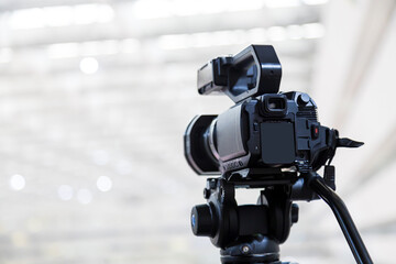 Video camera with blur background for journalist interview broadcasting reporter news or press...