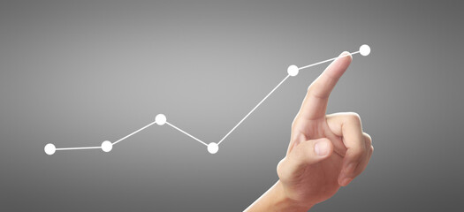 Hand touching graphs of financial indicator and accounting market economy analysis chart