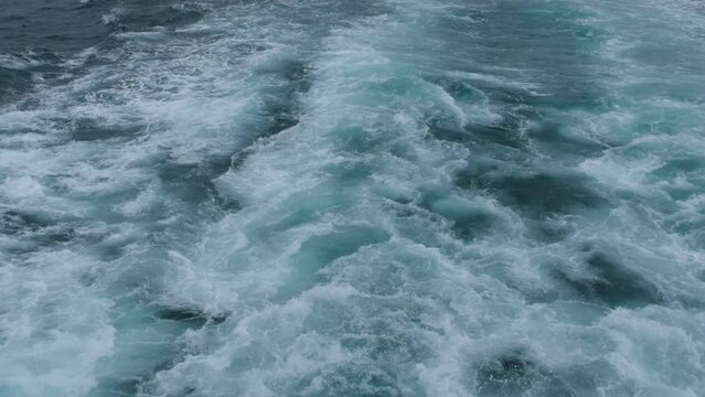 flowing sea water spindrift. Super slow motion 