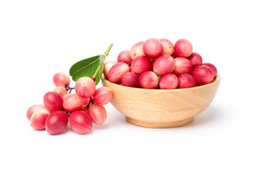 Carissa carandas fruit in wooden bowl isolated on white background.